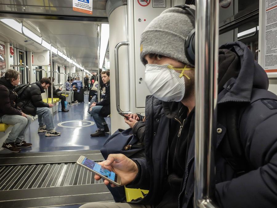 A man wearing a protective mask travels on the Milan's metro, Italy, 25 February 2020. Italian authorities say that there more than 300 confirmed cases of COVID-19 disease were registered in the country, with at least ten deaths. Precautionary measures and ordinances to tackle the spreading of the deadly virus included the closure of schools, gyms, museums and cinemas in the affected areas. (Cine, Italia) EFE/EPA/MATTEO CORNER