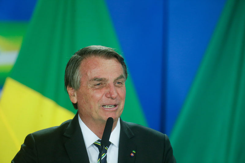O presidente Jair Bolsonaro rindo durante discurso