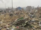 escombros de prédios após explosão em gana