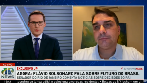 Frame do programa Os Pingos nos Is com participação de Flávio Bolsonaro, divido na tela com o apresentador