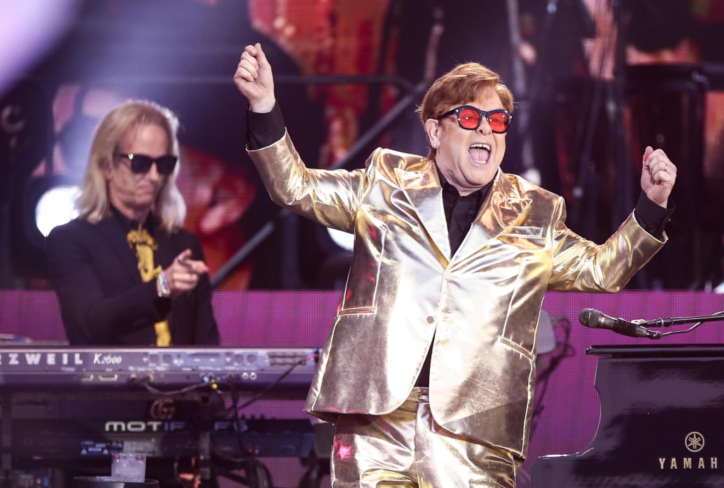 In tribute to George Michael, Elton John performs the final show of his career in the UK
