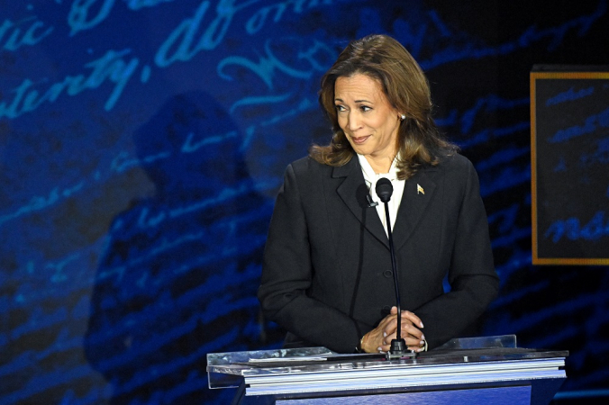 US Vice President and Democratic presidential candidate Kamala Harris listens as former US President and Republican presidential candidate Donald Trump speaks during a presidential debate at the National Constitution Center in Philadelphia, Pennsylvania, on September 10, 2024. (Photo by SAUL LOEB / AFP)