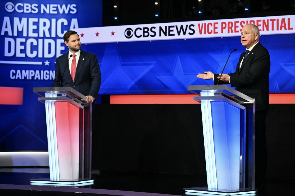 US Senator and Republican vice presidential candidate J.D. Vance (L) and Minnesota Governor and Democratic vice presidential candidate Tim Walz participate in the Vice Presidential debate hosted by CBS News at the CBS Broadcast Center in New York City on October 1, 2024. (Photo by ANGELA WEISS / AFP)