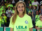 Leila Pereira com a camisa verde limão escrito Leila Presidente