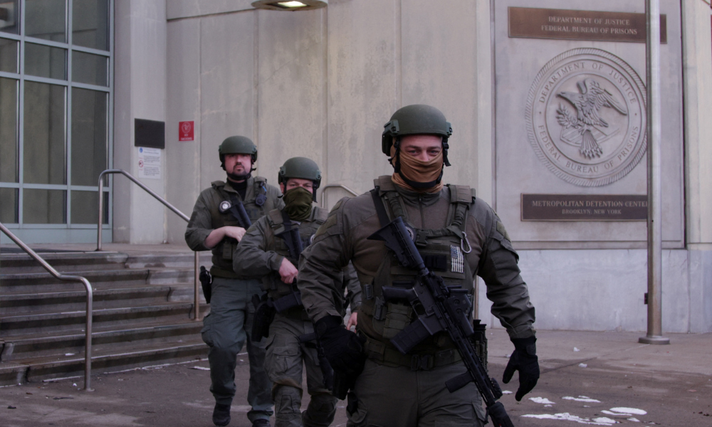 US Department of Justice federal officers stand guard outside the Metropolitan Detention Center, where ousted Venezuelan President Nicolas Maduro is being held, in the Brooklyn borough of New York City, on January 4, 2026. Venezuela's deposed president Nicolas Maduro is scheduled to appear before a federal judge in New York at noon on January 5, to be formally notified about the charges against him, the court said. Maduro and his wife, Cilia Flores, were seized by US forces during a pre-dawn raid on January 3 in Caracas and brought to New York to face charges of "narcoterrorism" tied to alleged trafficking of tons of cocaine into the United States.