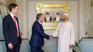 In this handout photo released by the Omani Ministry of Foreign Affairs on February 6, 2026, US special envoy Steve Witkoff shakes hands with Oman’s Foreign Minister Badr bin Hamad al-Busaidi as Jared Kushner looks on during a meeting in Muscat. Iran and the United States began talks on February 6 in Oman, with Washington refusing to rule out military action against its foe if diplomacy fails while the Islamic republic vowed to defend itself against "any excessive demands".