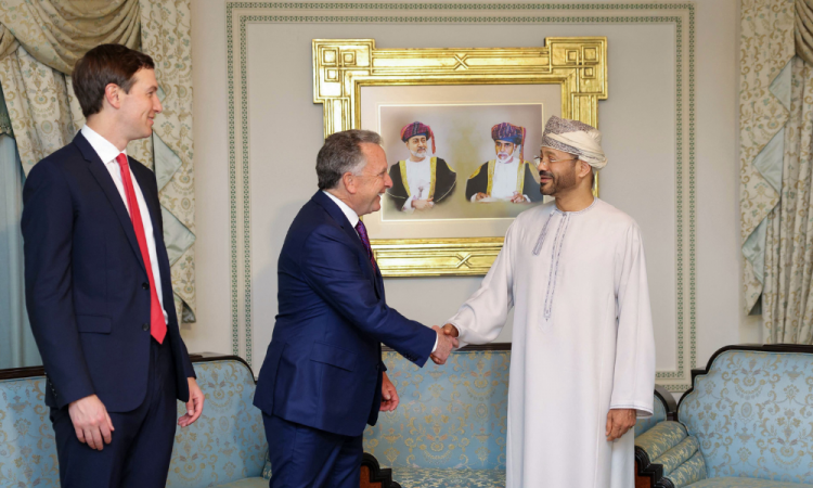 In this handout photo released by the Omani Ministry of Foreign Affairs on February 6, 2026, US special envoy Steve Witkoff shakes hands with Oman’s Foreign Minister Badr bin Hamad al-Busaidi as Jared Kushner looks on during a meeting in Muscat. Iran and the United States began talks on February 6 in Oman, with Washington refusing to rule out military action against its foe if diplomacy fails while the Islamic republic vowed to defend itself against "any excessive demands".