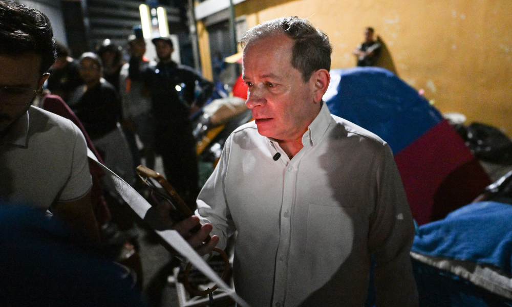 Venezuelan political leader Juan Pablo Guanipa gestures after their release outside Zona 7 prison in Caracas on February 8, 2026. Two opposition figures close to Venezuela's Nobel peace laureate Maria Corina Machado were freed from jail on February 8, 2026, one month after authorities began releasing political prisoners following the ouster of leader Nicolas Maduro.
