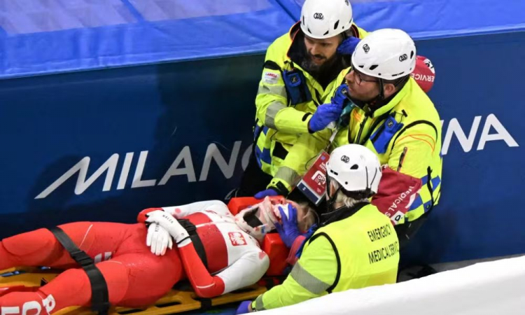 Athlete Kamila Sellier receives assistance