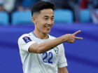Uzbekistan's midfielder #22 Abbosbek Fayzullaev celebrates after scoring his team's second goal during the Qatar 2023 AFC Asian Cup football match between Uzbekistan and Thailand at Al-Janoub Stadium in al-Wakrah, south of Doha, on January 30, 2024. (Photo by KARIM JAAFAR / AFP)