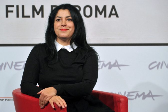 (FILES) Iranian writer and film director Marjane Satrapi poses during the photocall of her latest film "La bande des Jotas" (Gang of the Jotas) in Rome, on November 16, 2012 during the seventh edition of the Rome film festival. The Franco-Iranian artist Marjane Satrapi, who gained worldwide recognition with the graphic novel and film "Persepolis," has died at the age of 56, AFP learned on June 4, 2026 from her relatives. (Photo by TIZIANA FABI / AFP)
